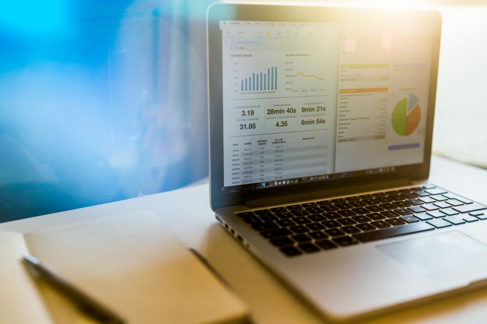 Laptop screen with data charts